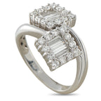 18K white gold diamond bypass ring with baguette center and halo of round diamonds