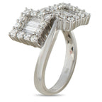 18K white gold diamond bypass ring, side view showing baguette and round diamond accents