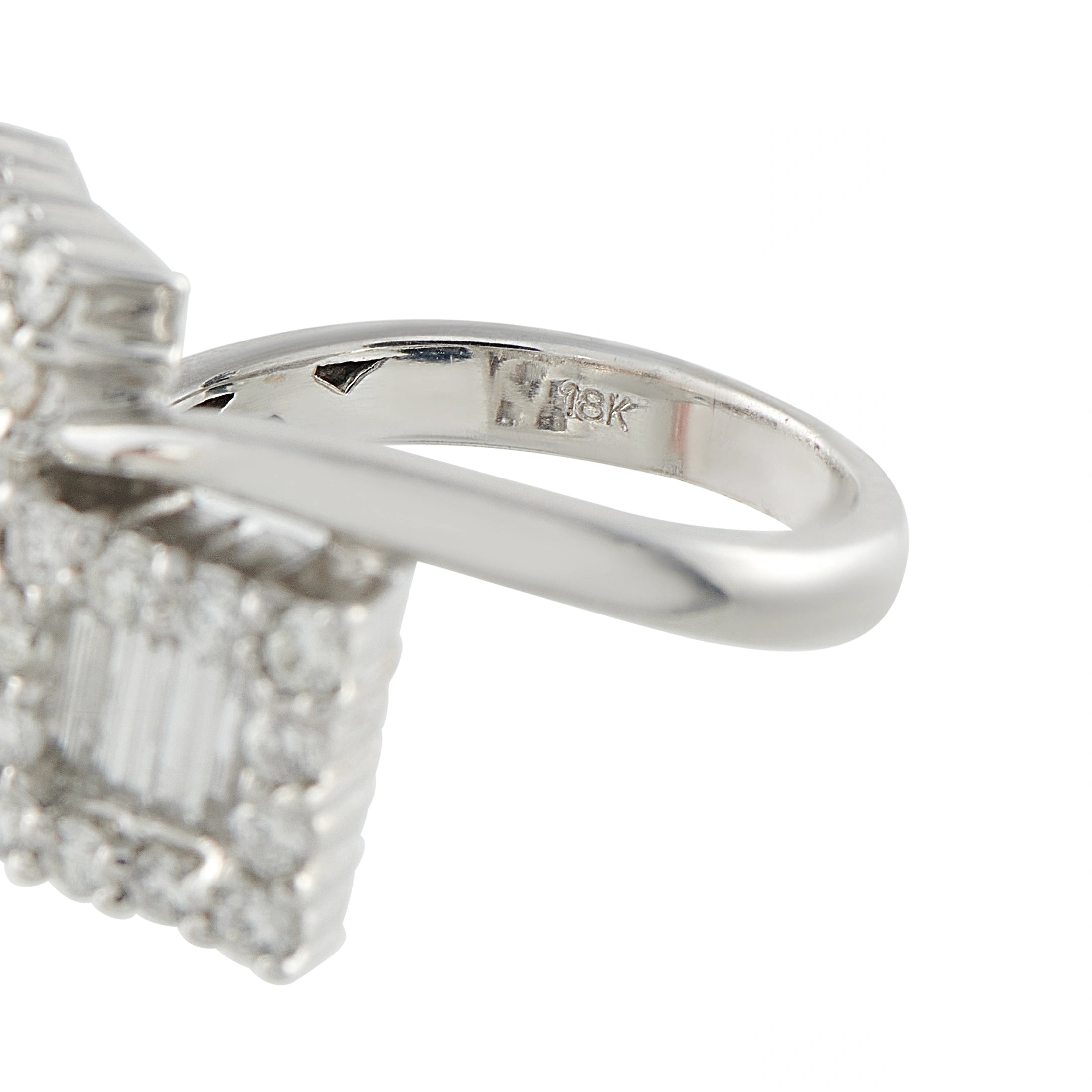 18K-marked white gold diamond bypass ring band interior close-up