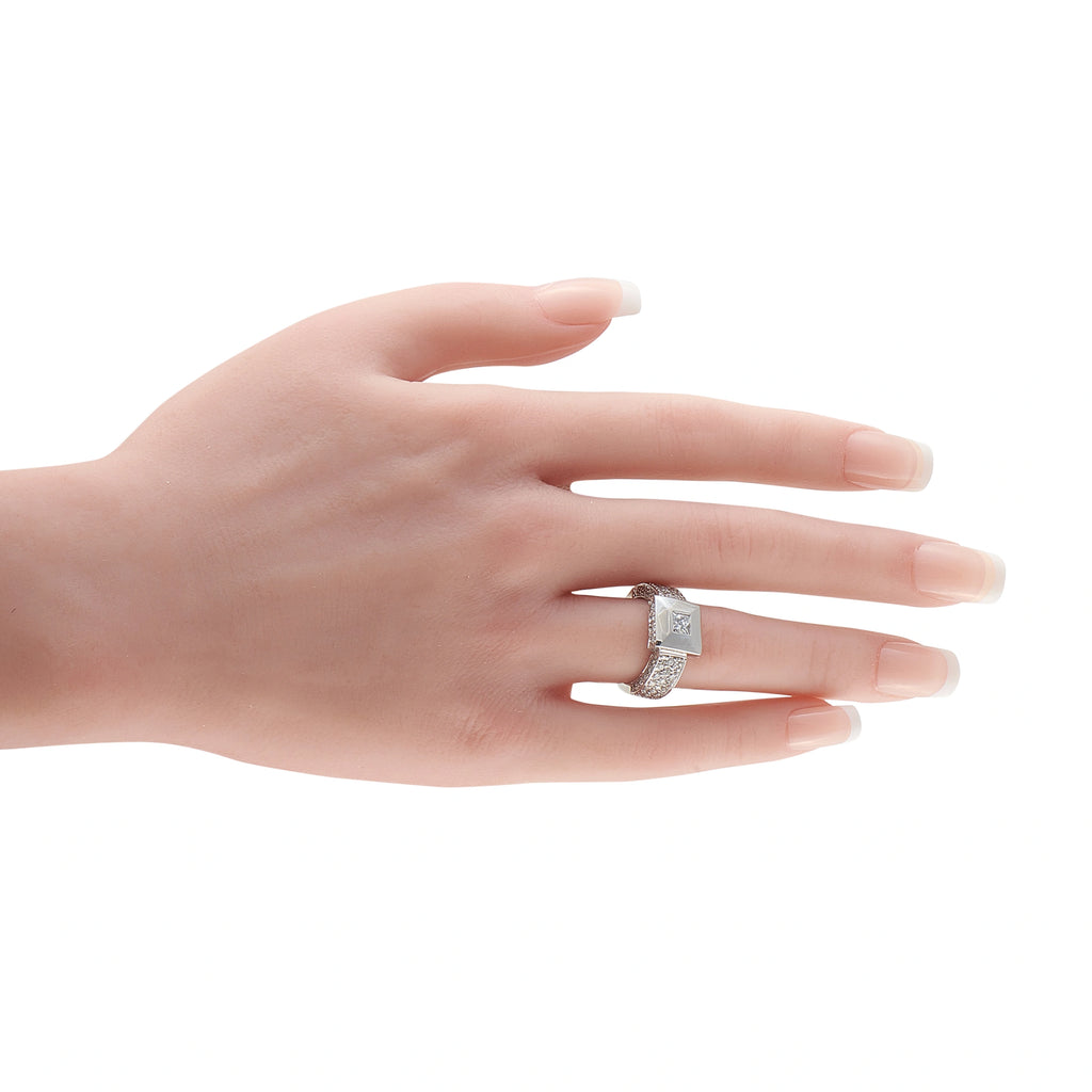 18K white gold diamond pyramid ring on a hand