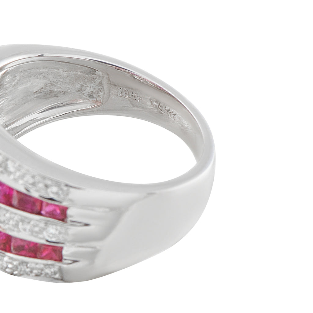 18K white gold ring close-up showing the inner band and ruby and diamond rows