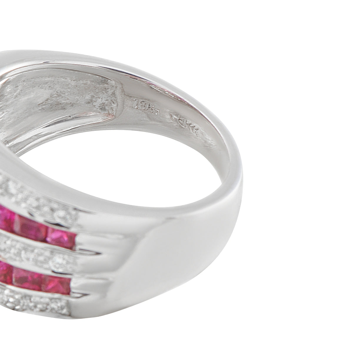 18K white gold ring close-up showing the inner band and ruby and diamond rows