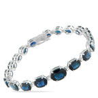 Exclusive White Gold 0.32ct Diamond and Sapphire Bracelet #5203 – Elegant in proportion and fluid in form, this Exclusive  br