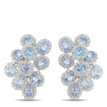 Clip-on earrings with oval blue stones and diamond-like halo on white metal