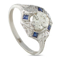 18K white gold octagon diamond ring with blue sapphire insets and faceted gallery