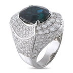 White gold ring featuring a dark oval center stone with sparkling diamond accents