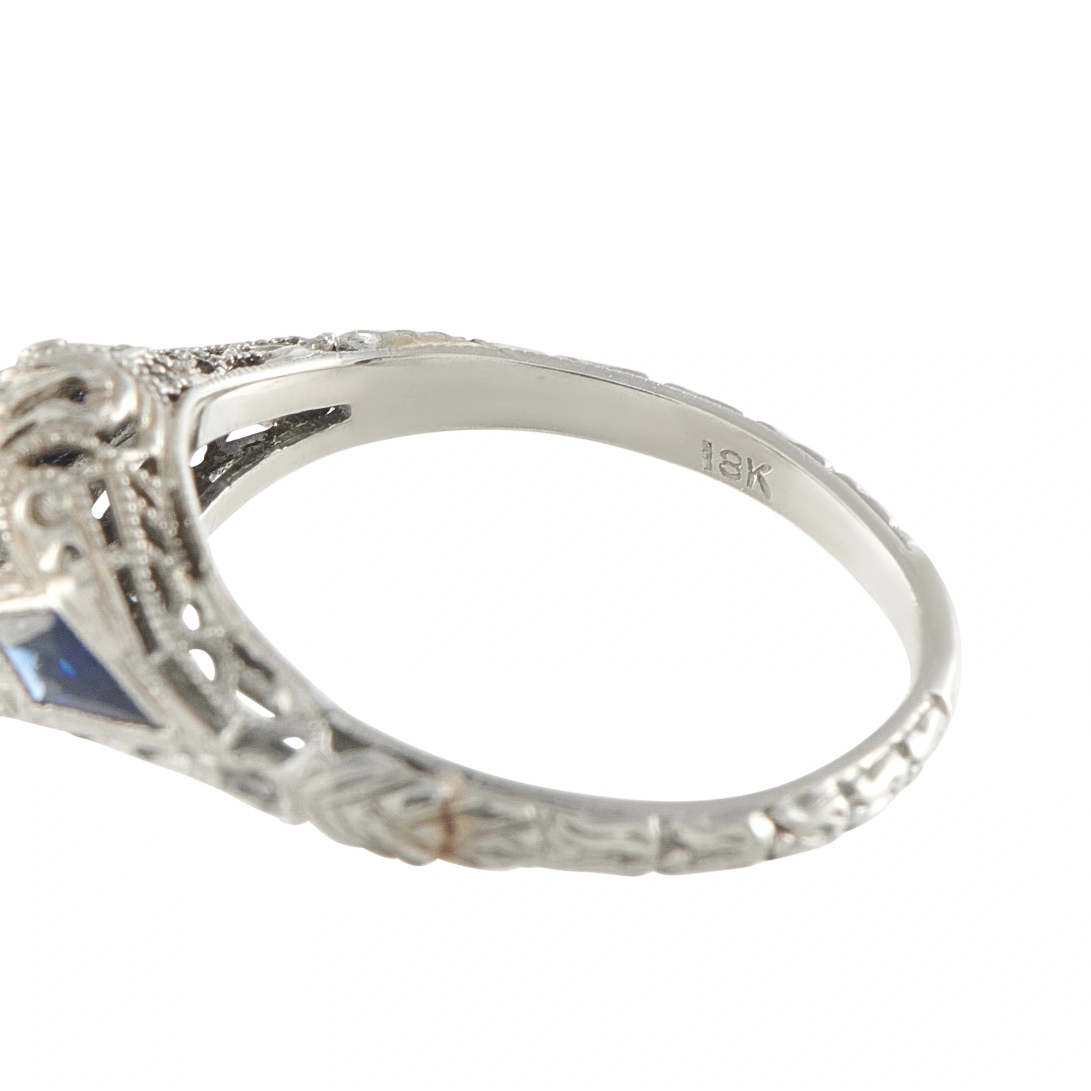 18K white gold ring band with hallmark; ornate Art Deco setting and blue accents