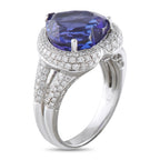 18K white gold ring with cushion-cut blue stone and diamond pave band