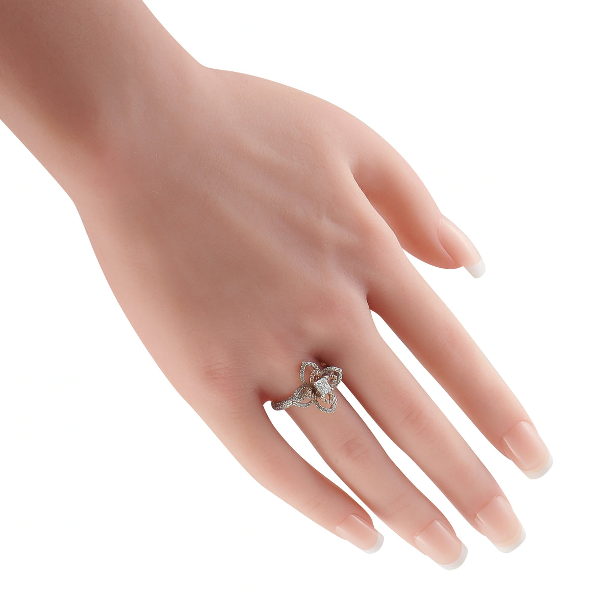 Diamond flower ring with white center stone and pink accents on a hand