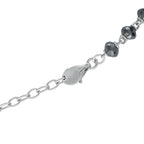 Necklace clasp view with alternating dark round beads and silver-tone link chain