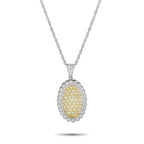 Diamond pendant with oval yellow center and white halo on silver chain