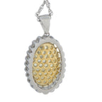 Oval diamond pendant with scalloped white border and yellow-gold center