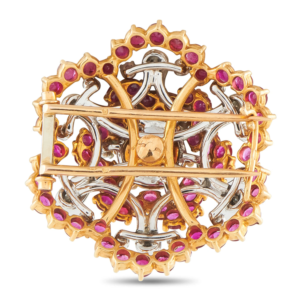 Gold and silver-toned brooch with purple ruby-style stones and openwork back frame