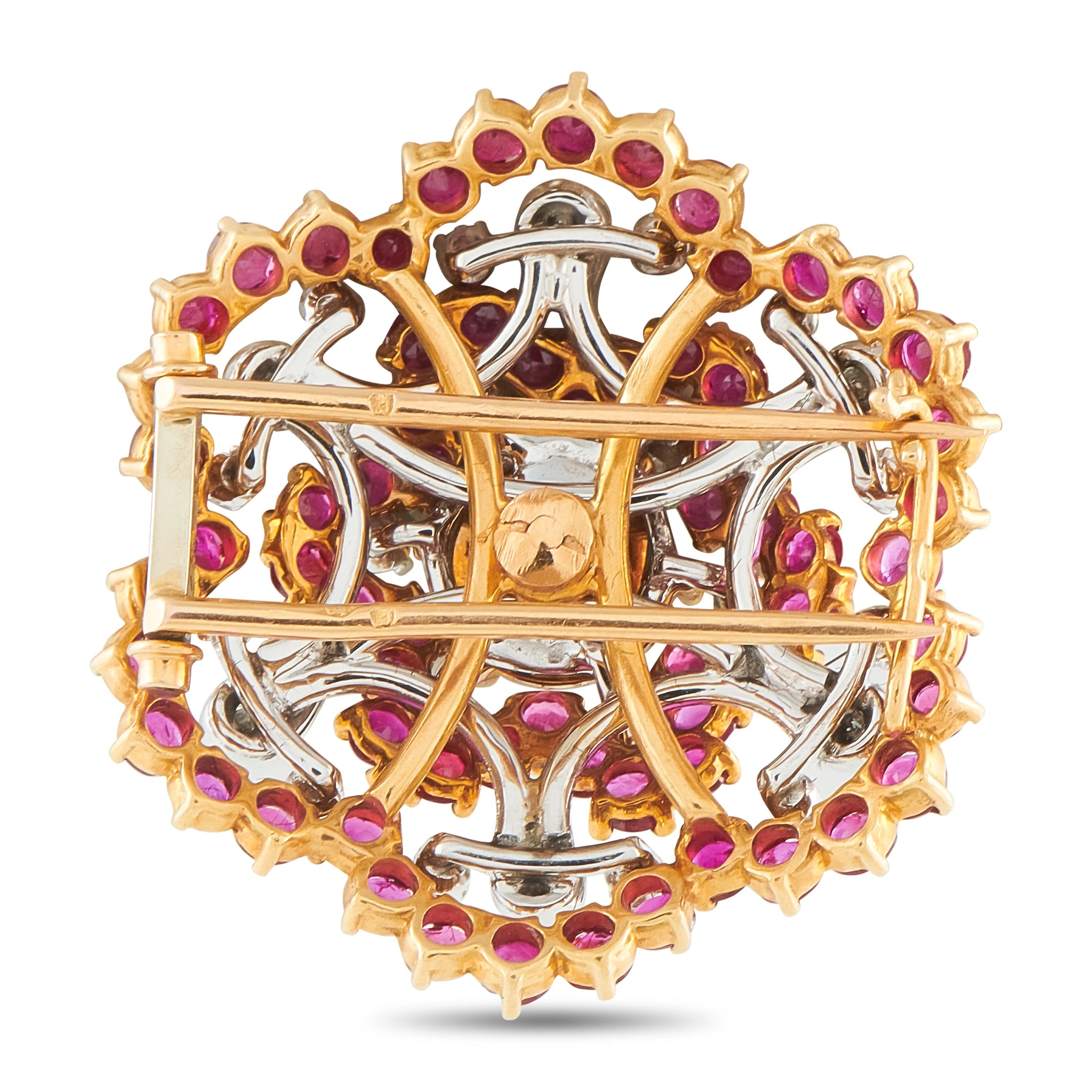 Gold and silver-toned brooch with purple ruby-style stones and openwork back frame