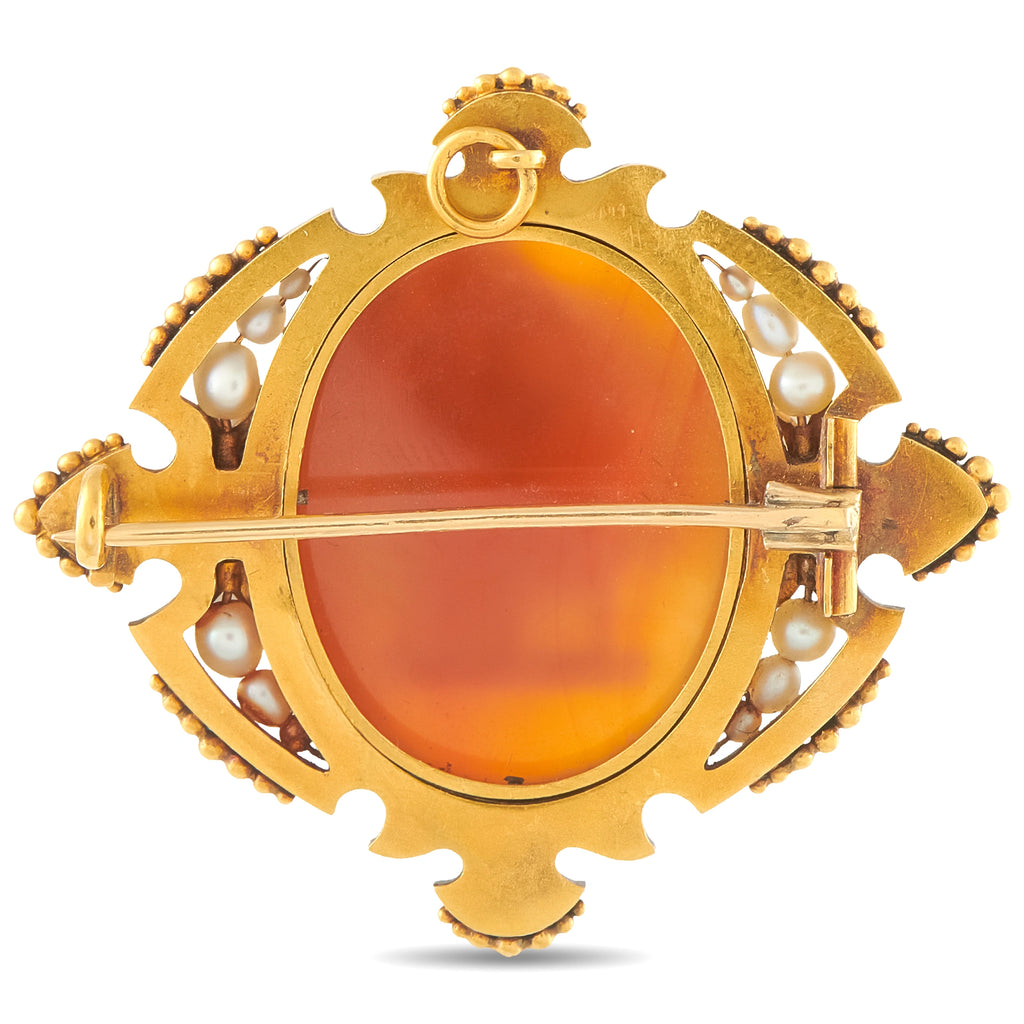 Antique-style gold cameo brooch with oval orange agate face and pin bar; pearls and blue enamel