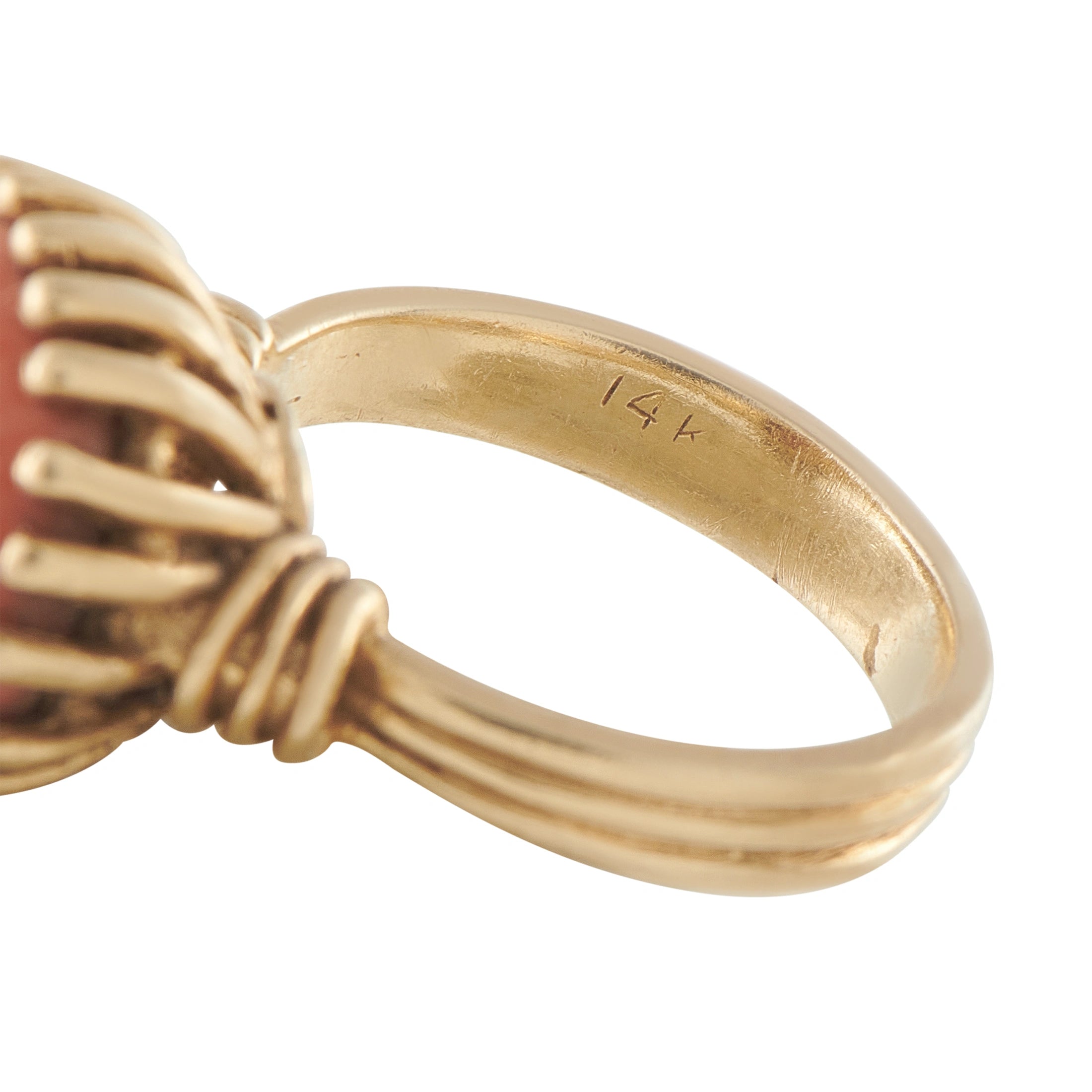 Gold ring band marked 14K with scalloped coral-stone setting base