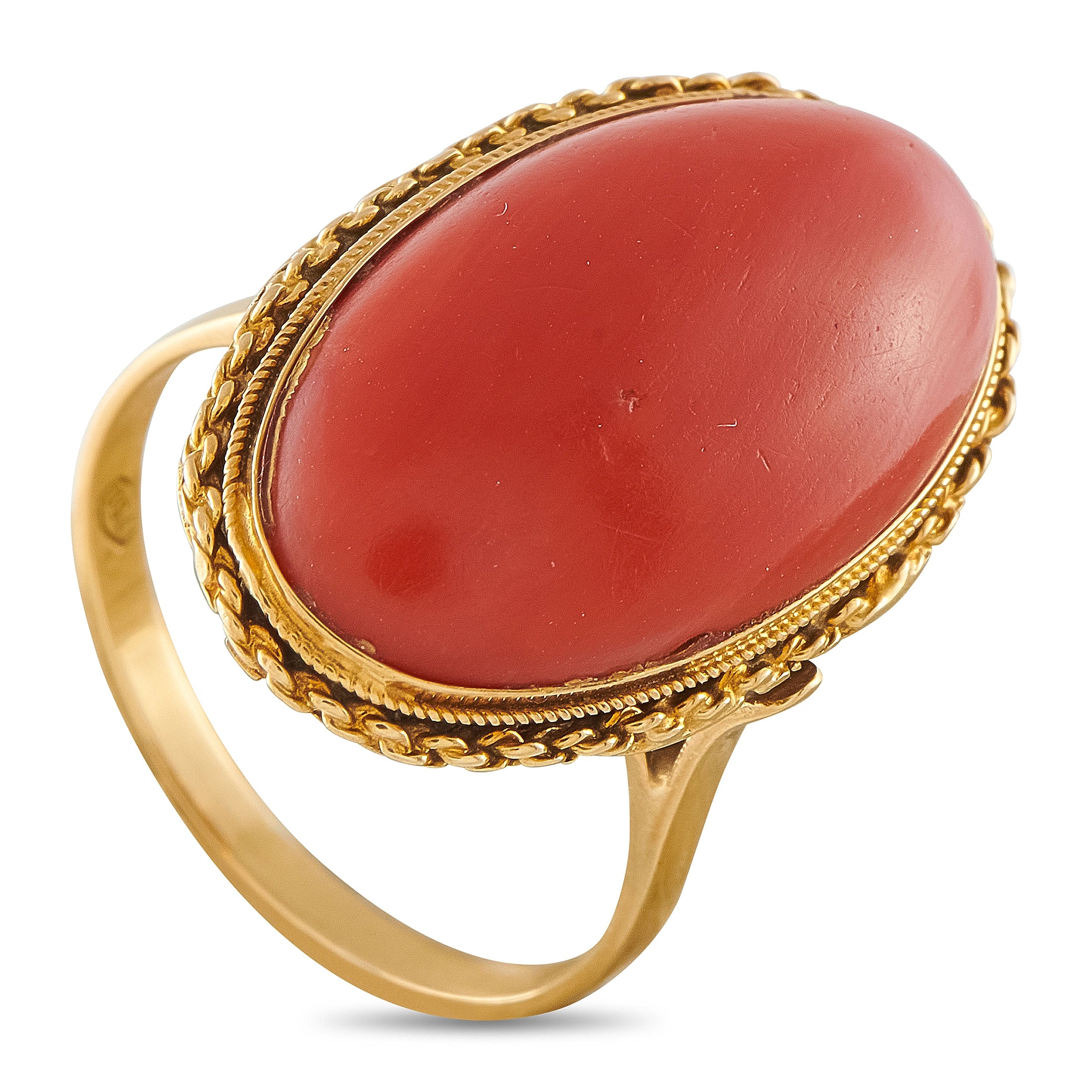 18K yellow gold cocktail ring with oval coral-red stone and ornate raised bezel