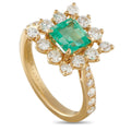 18K yellow gold ring with emerald center and diamond halo