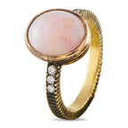 18k yellow gold ring with oval opal center and three diamond stones on ribbed band