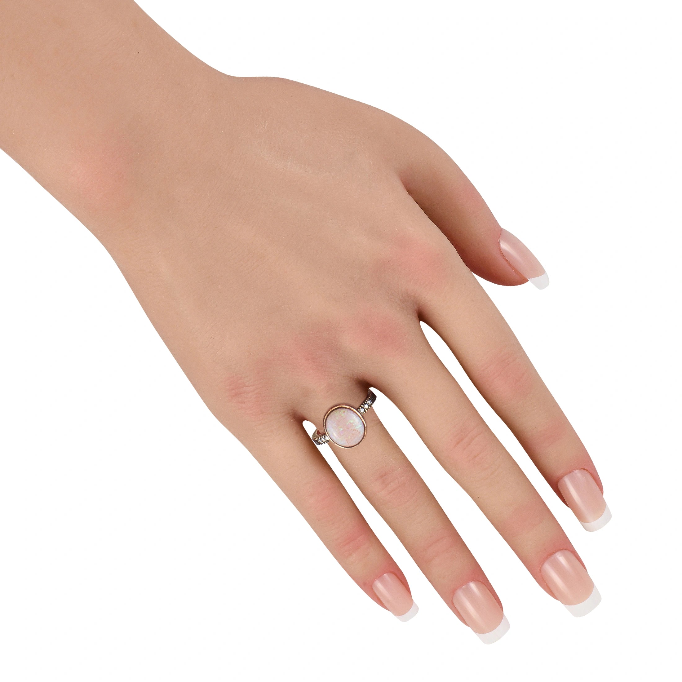 18k yellow gold opal ring with diamond accents on a ribbed band, worn on hand