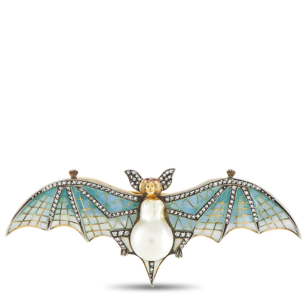 Enamel bat brooch with pear-shaped pearl body, gold head, and blue mosaic wings