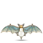 Enamel bat brooch with pear-shaped pearl body, gold head, and blue mosaic wings