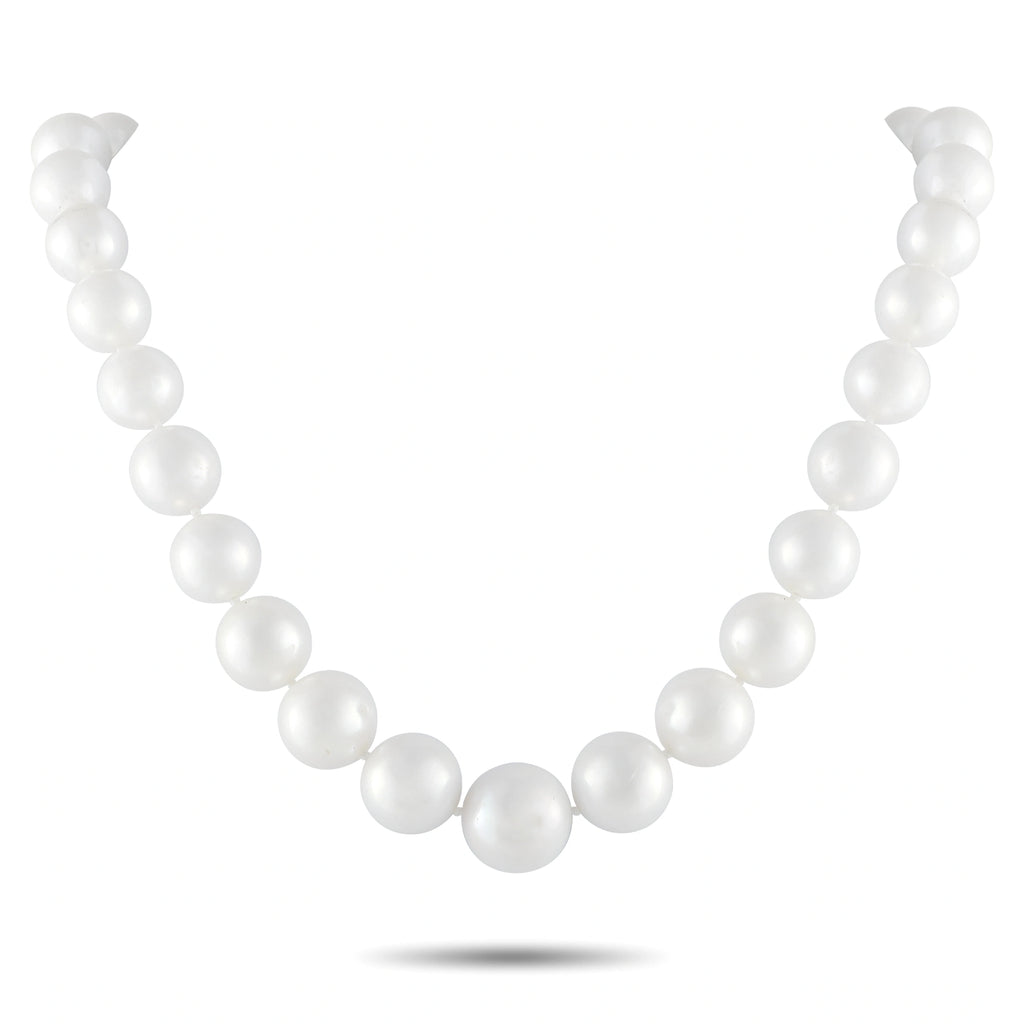 White pearl bead necklace with evenly spaced round pearls on a simple strand