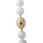 White pearl bead necklace with gold oval pendant and dangling pearl drops