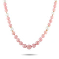 Pink and white bead necklace with round pink opal-style stones and gold accents