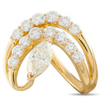 Yellow gold diamond cluster ring with oval center and round stones