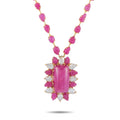 Ruby pink gemstone necklace with gold-tone prong pendant and clear stone accents