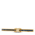 Yellow gold diamond-and-sapphire pin with blue sapphire bars and diamond bow
