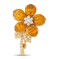 Yellow gold flower brooch with five textured petals and diamond-like center stones