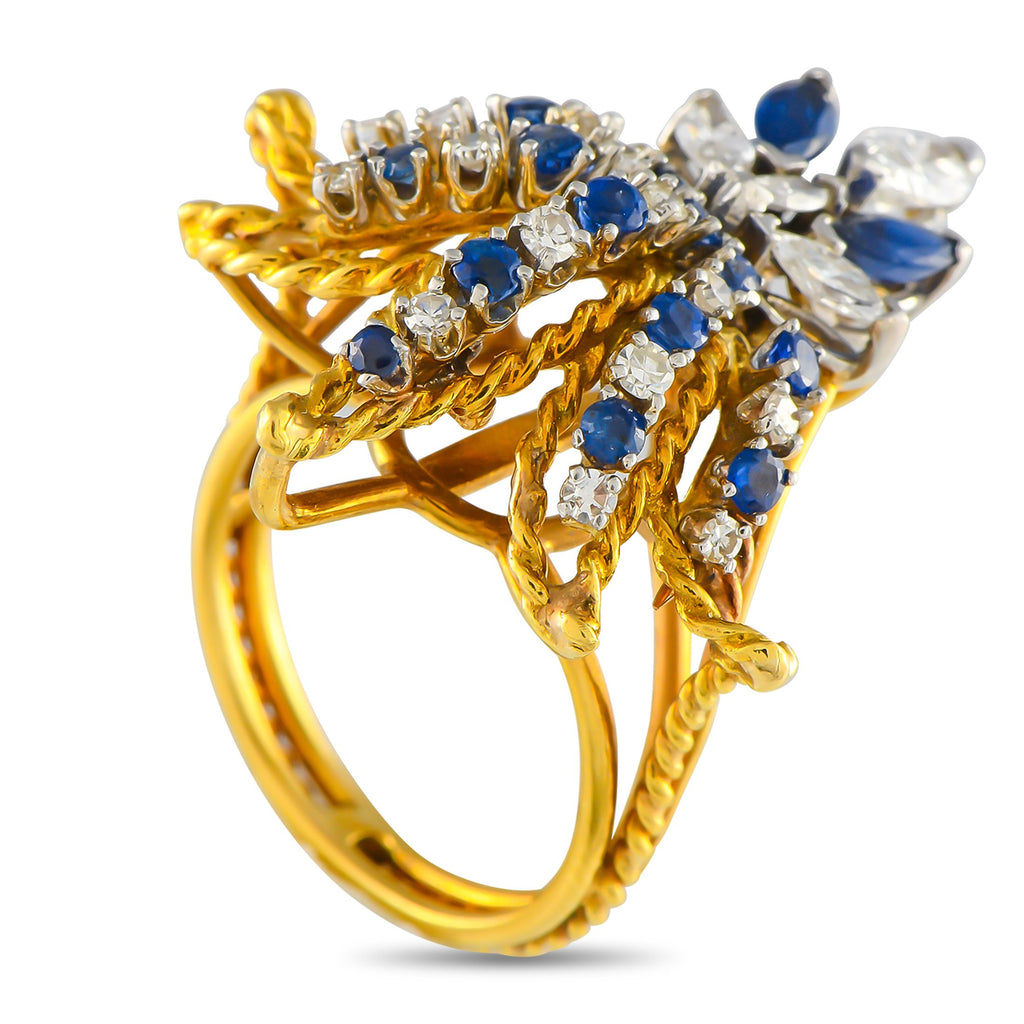 Exclusive 18K Yellow Gold 0.78ct Diamond and Sapphire Fleur de Lis Ring MF03-050525 – Exuding royal beauty, this yellow gold 