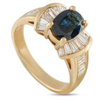 18K Yellow Gold 1.08ct Diamond and Sapphire Ring - A captivating 1.49 carat Sapphire serves as a stunning focal point on this luxury ring. Diamond baguettes with a total weight