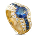 18K gold ring with oval blue sapphire and diamond halo, baguette accents