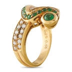 18k yellow gold ring with clustered green stones, large oval center, and diamonds