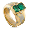 18K yellow gold ring with two emerald-cut green gemstones, hex setting