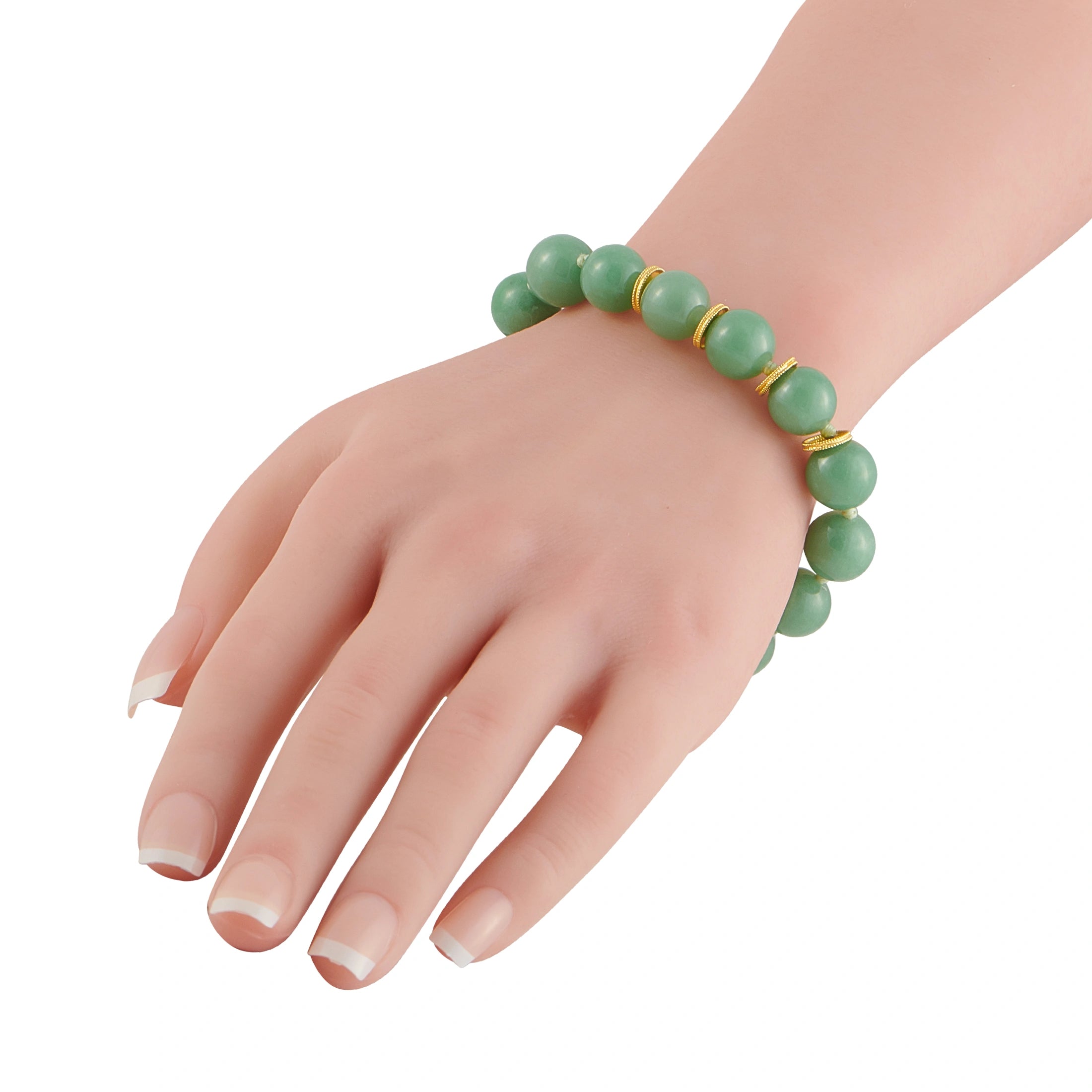 Green jade bead bracelet worn on wrist with yellow gold clasp and links