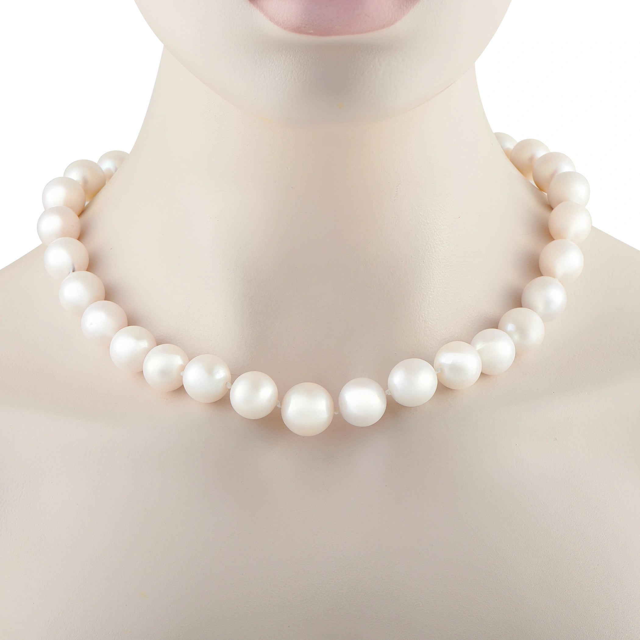 White pearl bead necklace with smooth round beads, close-up on neck