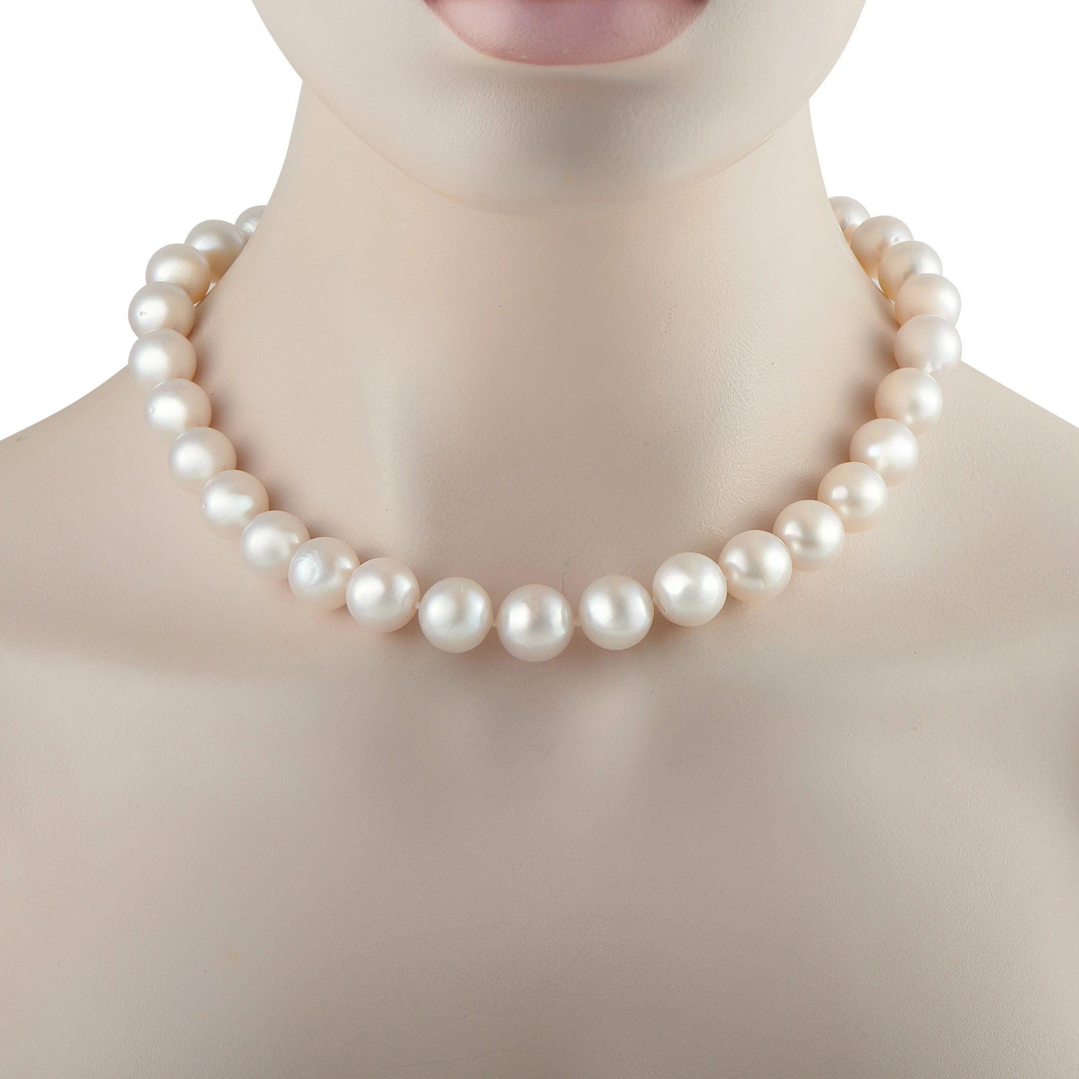 White pearl bead necklace close-up with rounded, glossy pearls