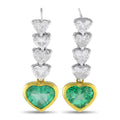 Heart emerald dangle earrings with diamond accents in yellow gold and platinum