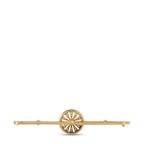 Antique gold brooch with circular sunburst center and small diamond-like stones