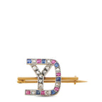 Antique-style gold brooch with gem border, diamond-like stones, and hinged pin