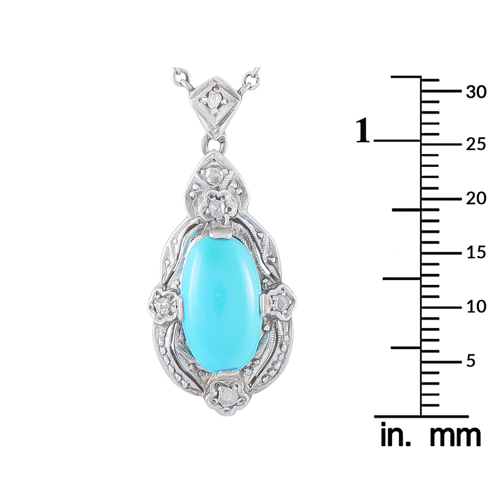 Turquoise oval pendant with diamond halo and ornate silver-toned setting