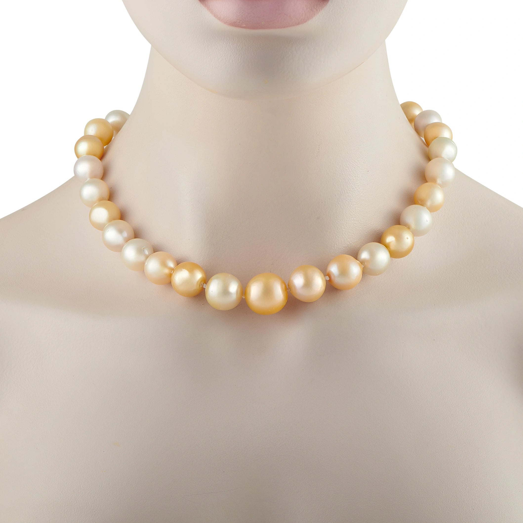 Pearl bead necklace with alternating white and gold-toned beads, close-up on collar