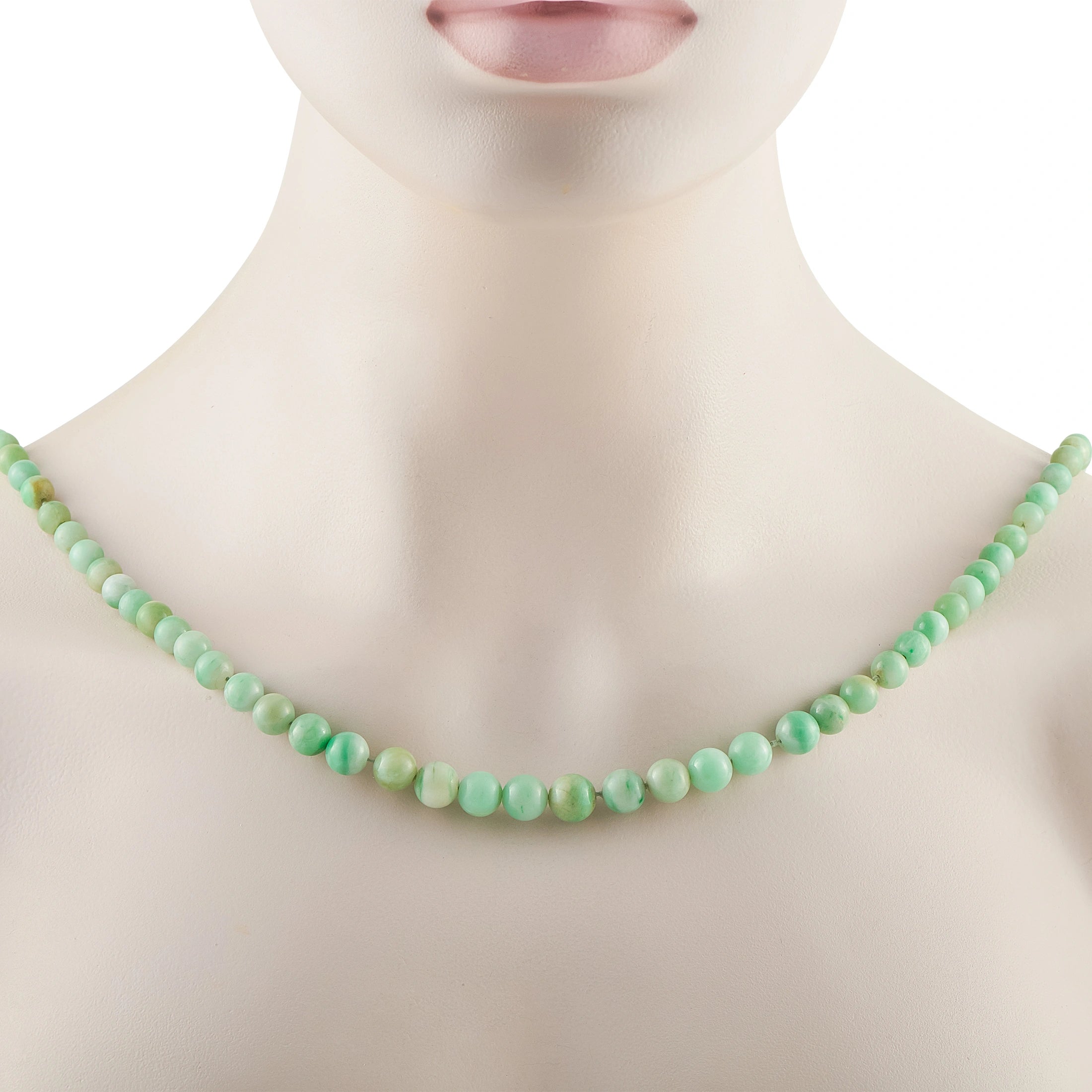 Jade bead necklace on a model neck featuring smooth round green beads.