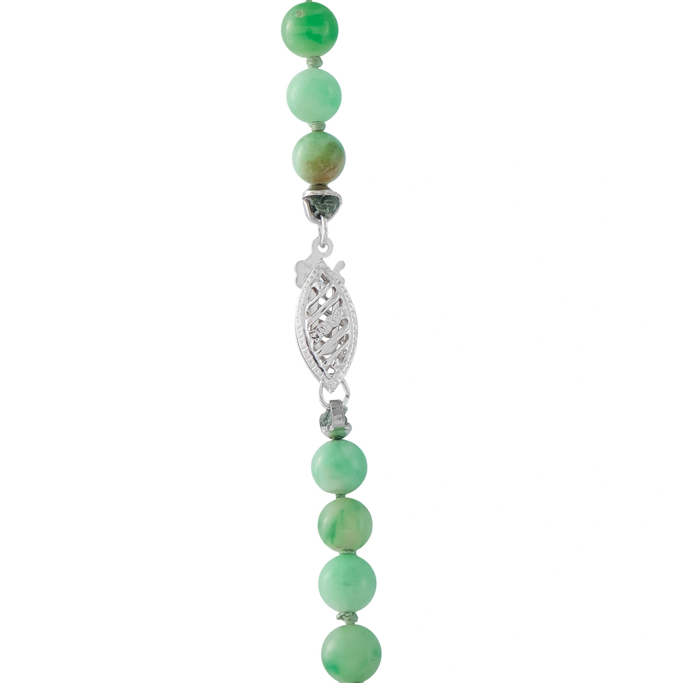 Jade bead necklace with green beads and a silver-tone leaf charm connector.