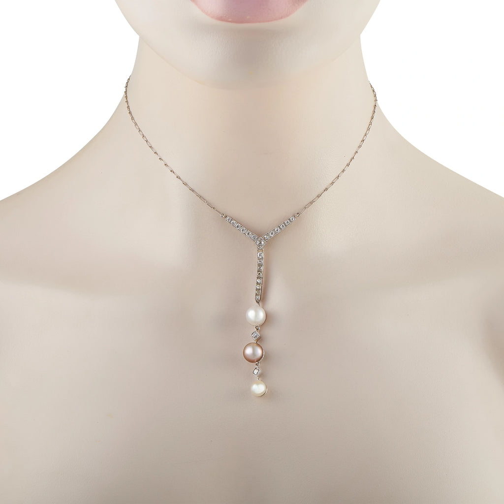 Diamond and pearl pendant necklace with V-shaped diamond bail and three pearls