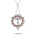 Diamond, ruby, and pearl pendant with circular halo and central teardrop